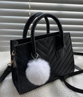 Black Quilted Chevron Handbag with Pom-Pom